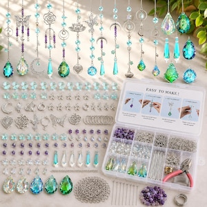 May include: A DIY suncatcher making kit featuring various silver-toned metal charms, including butterflies, moons, stars, and flowers, alongside faceted blue, green, and purple crystal pendants, jump rings, chains, and a pair of pink-handled pliers.