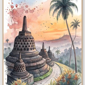 Peut inclure: Une peinture à l'aquarelle représentant des stupas en pierre avec des structures en forme de cloche et des motifs en treillis. Un chemin pavé serpente à travers la scène, entouré de palmiers tropicaux et de fleurs orange sous un ciel au crépuscule.