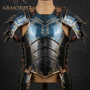 May include: A handcrafted, blue and black armor breastplate with gold accents, displayed on a mannequin. The armor features intricate designs and leather straps. The word "ARMORIST" is visible.