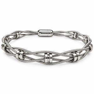 May include: A silver-toned bracelet constructed from multiple flexible metal wire strands woven together. The design features several smooth, cylindrical metal spacers positioned along the length of the strands, secured by a polished, oblong magnetic clasp.