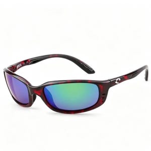 May include: Sunglasses with a red and black speckled frame and reflective lenses that show blue and green hues. The sunglasses have a curved design and a black arm with a white logo.