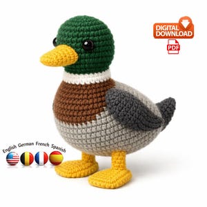 May include: A crocheted duck with a green head, brown body, and gray wings. The duck has a yellow beak and feet. The image includes the text "DIGITAL DOWNLOAD" and "PDF".