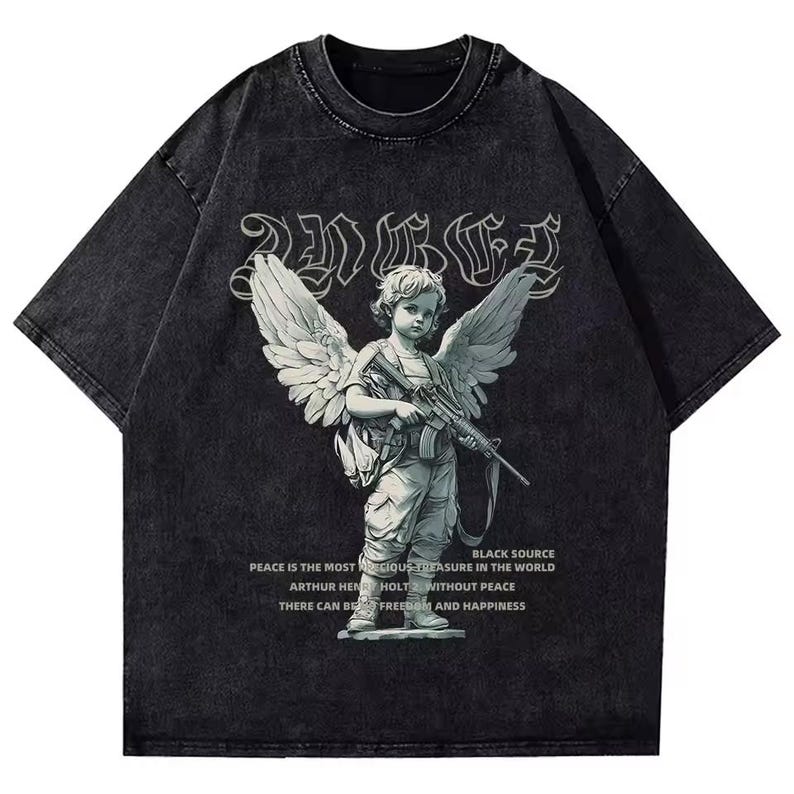 May include: Dark grey short-sleeved t-shirt with a faded effect. The front displays a graphic of an angel with a rifle, accompanied by text. The text includes the words "Peace" and "Freedom".
