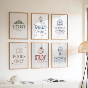 May include: Six framed wall art prints with text and illustrations. The prints include the words "Library," "Quiet Please," "Reading Zone," "Books Only," "Study Area," and "Knowledge Corner." The frames are light brown, and the background is white.