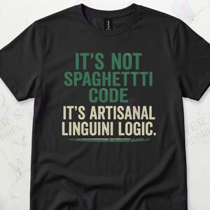 May include: Black t-shirt with the text "IT'S NOT SPAGHETTI CODE IT'S ARTISANAL LINGUINI LOGIC." The text is in green and white. The shirt is a casual wear item.
