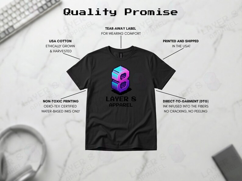 May include: Black t-shirt with a pixelated number 8 graphic in blue and purple, and the text "LAYER 8 APPAREL". The shirt is made with USA cotton and non-toxic printing.