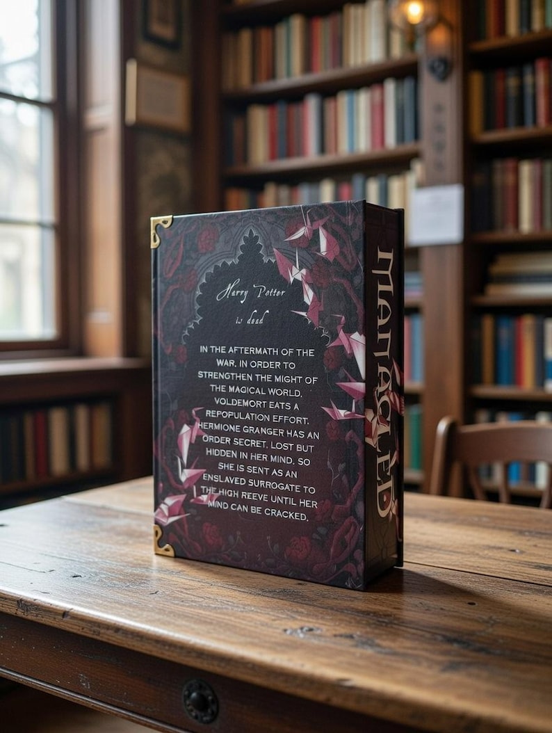 May include: A hardback book with the title "Harry Potter is dead" on the cover. The book features a dark background with burgundy floral and geometric designs, and gold accents. The spine reads "MACLED".