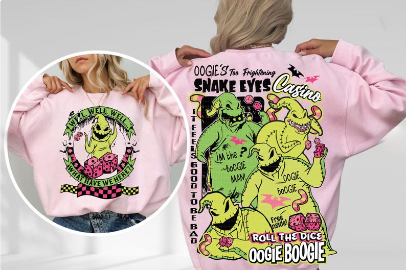 May include: Pink sweatshirt featuring a graphic of Oogie Boogie from The Nightmare Before Christmas. The front has a circular design with the text "Well, Well, Well, What Have We Here?". The back displays Oogie Boogie and the text "Snake Eyes Casino".