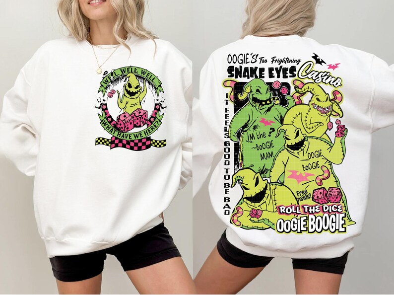 May include: White sweatshirt featuring a graphic of Oogie Boogie from The Nightmare Before Christmas. The front design includes the text "Well Well Well, What Have We Here?" The back features Oogie Boogie and the text "Snake Eyes Casino."