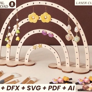 May include: A wooden rainbow-shaped earring display stand with multiple arches. The stand holds various earrings, including flower and heart-shaped designs. The image also shows makeup brushes and the text "DIGITAL DOWNLOAD" and "LASER CUT FILE".