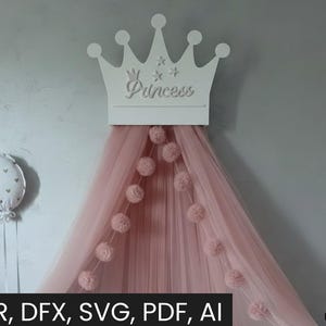 Puede incluir: Una corona blanca cortada con láser con la palabra "Princess" está montada sobre un dosel de tul rosa. Pompones rosas están ensartados a lo largo del dosel. Un globo decorativo con forma de corazón está a la izquierda. La imagen incluye el texto "CDR, DFX, SVG, PDF, AI".