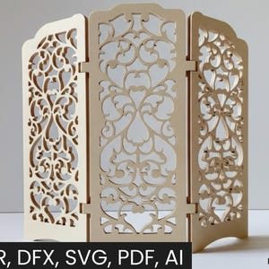 May include: A three-panel, laser-cut wooden screen with intricate floral and scrollwork designs. The screen is a light beige color and features the text "Laser cut" and "CDR, DFX, SVG, PDF, AI" and "DIGITAL PRODUCT".