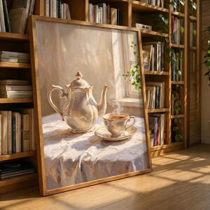 May include: A framed painting depicts a still life with a teapot and teacup on a white tablecloth. The teapot and teacup are white with gold accents. Steam rises from the cup. The painting is in a wooden frame and is set against a backdrop of bookshelves.