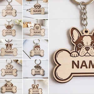 May include: Wooden dog bone keychains with various dog breeds. Each keychain features a dog illustration above a bone-shaped tag with the word "NAME" engraved. The keychains are attached to silver keyrings.