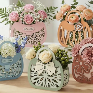 May include: A white ceramic mug with a black handle and the text "But First, Coffee" in a bold, black font. The mug is filled with a dark liquid, likely coffee, and sits on a light-colored surface.