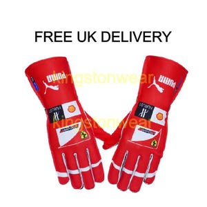 May include: Pair of red racing gloves with white and yellow detailing. The gloves display the Puma logo and sponsor branding. The text "FREE UK DELIVERY" is at the top.