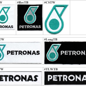 May include: A collection of seven embroidered patches featuring the Petronas logo in various rectangular and custom shapes. The designs include teal and white or teal and black color schemes, with some patches displaying the Petronas text.