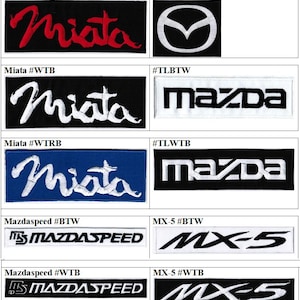 May include: A collection of ten rectangular embroidered patches featuring various Mazda-related logos and text. Designs include the Miata script in red or white on black or blue backgrounds, the Mazda emblem, Mazda text, Mazdaspeed, and MX-5 logos.