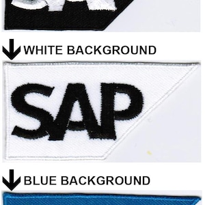 May include: Three triangular embroidered patches featuring the text SAP. The first patch has a black background with white lettering, the second has a white background with black lettering, and the third has a blue background with white lettering.
