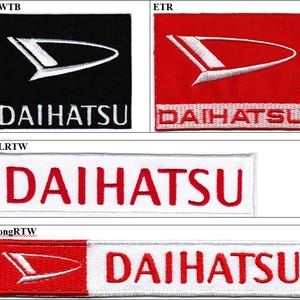 May include: A collection of four rectangular embroidered patches featuring the Daihatsu logo and brand name. The set includes a black patch with a white logo, a red patch with a white logo, a white patch with red text, and a red and white patch.
