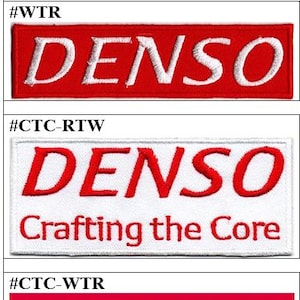 May include: A set of four rectangular embroidered patches featuring the DENSO logo. Two patches have red text on a white background, and two have white text on a red background. Two patches include the additional text Crafting the Core.