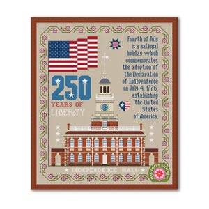 May include: Cross-stitch design commemorating the Fourth of July, featuring the American flag, Independence Hall, and text that reads "250 Years of Liberty." The design includes floral and star motifs, and the text "Independence Hall."