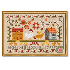 May include: Cross-stitch sampler featuring a farm scene with a yellow house, a gray house, a rooster, a hen, and chicks. The sampler includes floral and vine motifs, birds, and the alphabet. The frame is a light brown color.