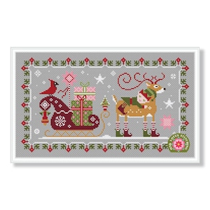 May include: Cross-stitch design featuring a Christmas scene with a reindeer and a sleigh. The reindeer is brown with a green scarf and striped legs. The sleigh is red and carries gifts. A red cardinal sits on the sleigh.