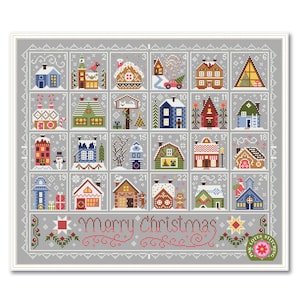 Puede incluir: Un calendario de adviento navideño de punto de cruz con 24 casas detalladas, cada una con un diseño y color únicos. Las palabras "Merry Christmas" están bordadas en rojo en la parte inferior. El diseño está enmarcado en un borde gris.
