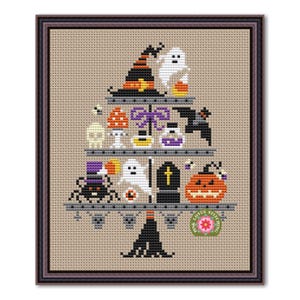 May include: Cross-stitch design featuring a Halloween tree with various spooky elements. The tree is adorned with a witch's hat, ghosts, a pumpkin, a spider, and other festive decorations. The design is framed in a dark brown frame.