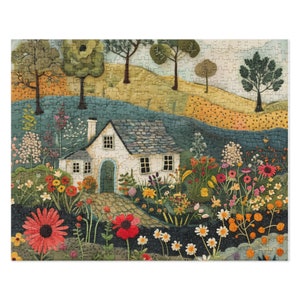 A quilted cottage jigsaw puzzle featuring a white English cottage with a blue roof and green door, surrounded by colorful flowers, trees, and a whimsical garden with stitched and painted textures.