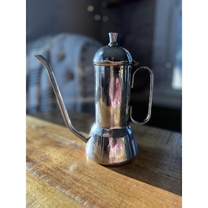 May include: A rustic wooden sign with the text "Welcome to our home" in white lettering. The sign features a distressed finish and a simple, inviting design, perfect for entryway decor.