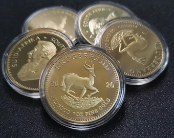 Guldfärgade replikmynt av hjort – Souvenirset (10 stycken, blandade år)