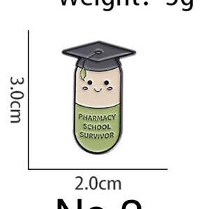 May include: A pin shaped like a smiling pill wearing a graduation cap. The pin is 3.0 cm tall and 2.0 cm wide, with the text "PHARMACY SCHOOL SURVIVOR" on the pill. The pin weighs 3 grams. The number "No. 2" is at the bottom.