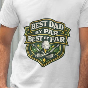 White t-shirt featuring golf clubs, ball and dad slogan