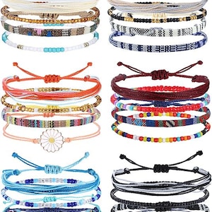 May include: A collection of adjustable friendship bracelets in various colors and designs. The bracelets feature woven patterns, beads, and charms, including a daisy. Colors include blue, white, black, red, orange, and yellow. These bracelets are perfect for casual wear.