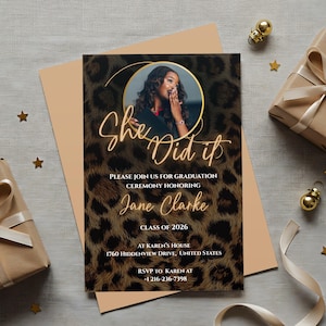 May include: A graduation announcement with a leopard print background and the words "She Did It" in gold script. The announcement includes a photo of a woman and details for the graduation ceremony, including the graduate's name, Jane Clarke.
