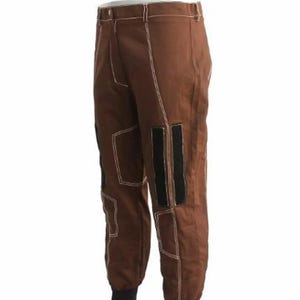 May include: Brown pants with white stitching and black accents. The pants have a fitted ankle and a button closure. The design includes reinforced patches and a classic, utilitarian style.