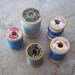 Wooden Spools of Thread in Blues