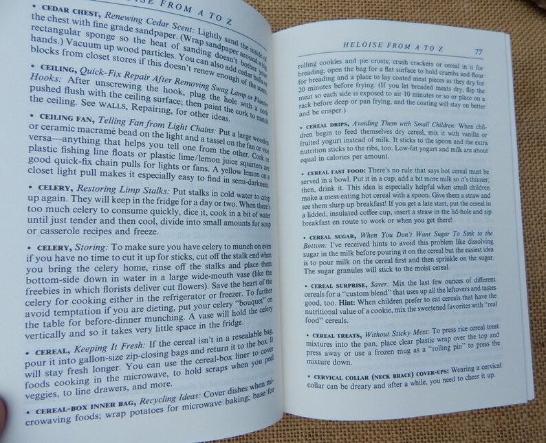 May include: Open book with text on a beige background. The text includes tips on home and kitchen topics, such as renewing cedar scent, quick fixes, and storing celery. The page numbers are visible.