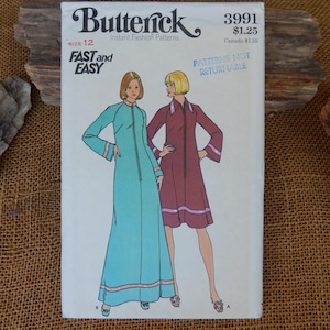 May include: A Butterick 3991 sewing pattern envelope for size 12, labeled Fast and Easy. The front shows illustrations of two garments: a floor-length turquoise dress and a knee-length maroon dress, both with front zippers and contrasting trim.