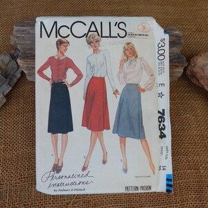 May include: A McCalls sewing pattern envelope 7634 featuring illustrations of three different skirt and blouse combinations. The pattern includes personalized instructions by Palmer and Pletsch, with a listed miss size of 14 and a price of $3.00.