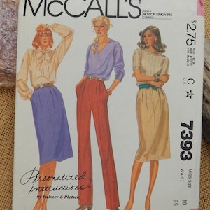 May include: McCall's sewing pattern number 7393 for a women's skirt. The pattern includes three different skirt styles: a purple skirt, a red skirt, and a beige skirt. The pattern is for sizes 10 to 25.