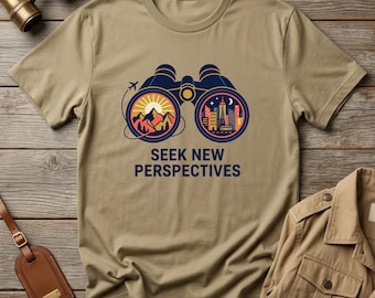 Camiseta gráfica "Busca nuevas perspectivas", camiseta con ilustración de binoculares de viaje, ropa para exploradores con espíritu aventurero.
