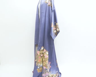 May include: A long, flowing purple silk kimono with a floral pattern in shades of pink, white, and gold. The kimono is displayed on a white mannequin.