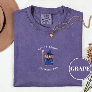 May include: A set of three ceramic mugs with a speckled, matte finish in cream, light grey, and dark grey. Each mug has a simple, minimalist design, ideal for coffee or tea.