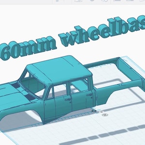 May include: A light blue 3D model of a pickup truck body shell with an open cargo bed and a cabin. The text 160mm wheelbase is displayed in large, three-dimensional light blue letters floating above the truck model.