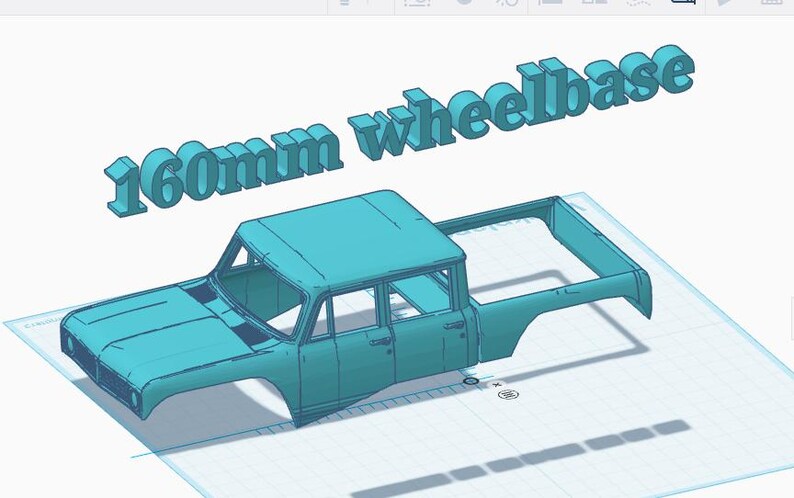 May include: A light blue 3D model of a pickup truck body shell with an open cargo bed and a cabin. The text 160mm wheelbase is displayed in large, three-dimensional light blue letters floating above the truck model.