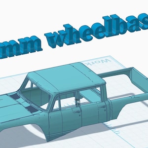 May include: A light blue 3D model of a pickup truck body shell featuring a cabin and an open cargo bed. The text 155mm wheelbase is displayed in large, bold, light blue letters above the vehicle model on a grid background.
