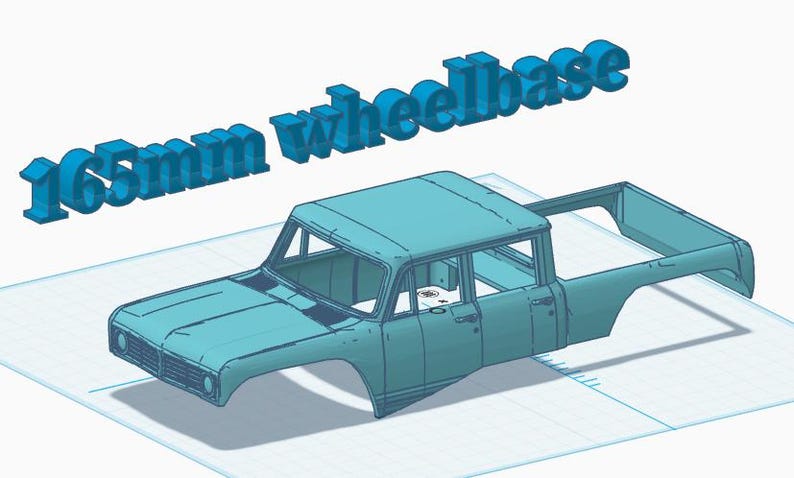 May include: A light blue 3D model of a pickup truck body shell featuring a crew cab design. The text 165mm wheelbase is displayed in large, three-dimensional blue letters above the vehicle model, indicating the specific wheelbase measurement.